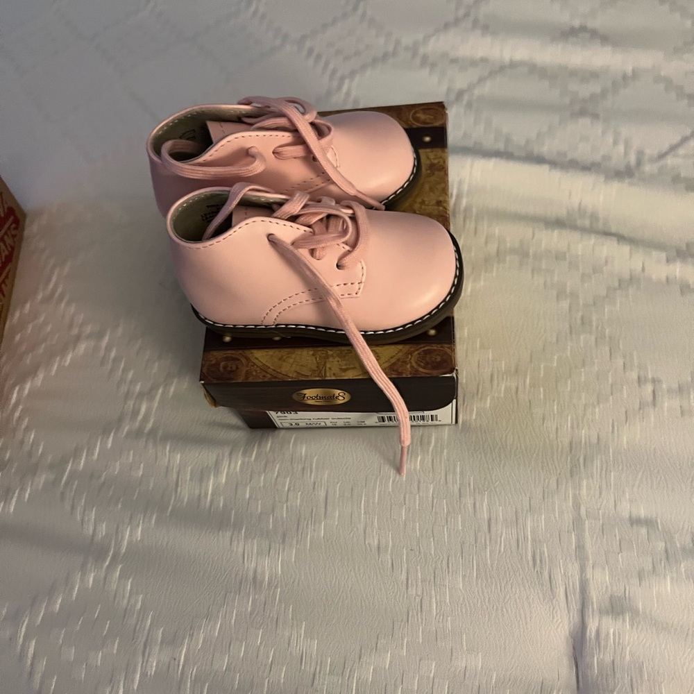 Baby walking shoes, baby pink in color ! Never been worn